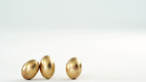 golden easter eggs on white background