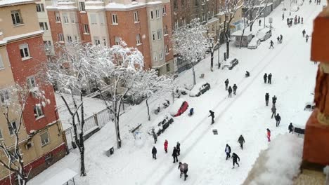 heavily snowed street of madrid viewed from a window