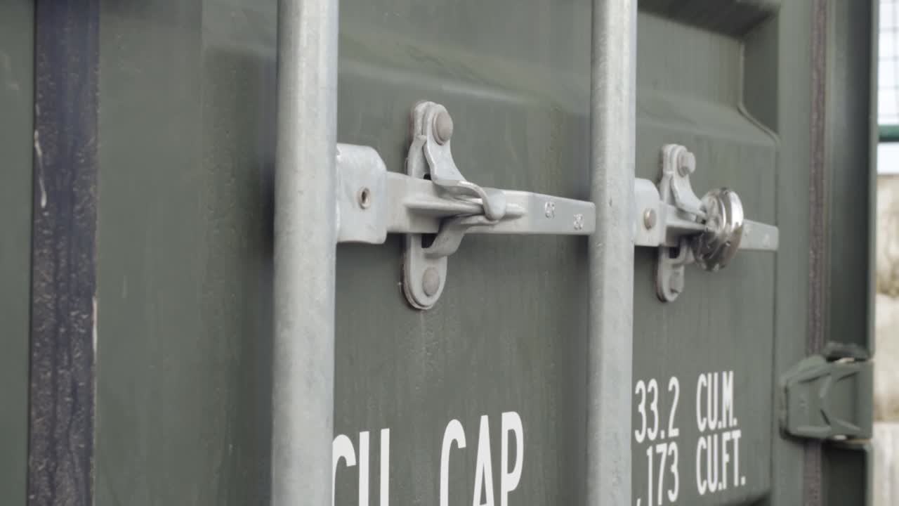 Shipping container green close up tilting shot