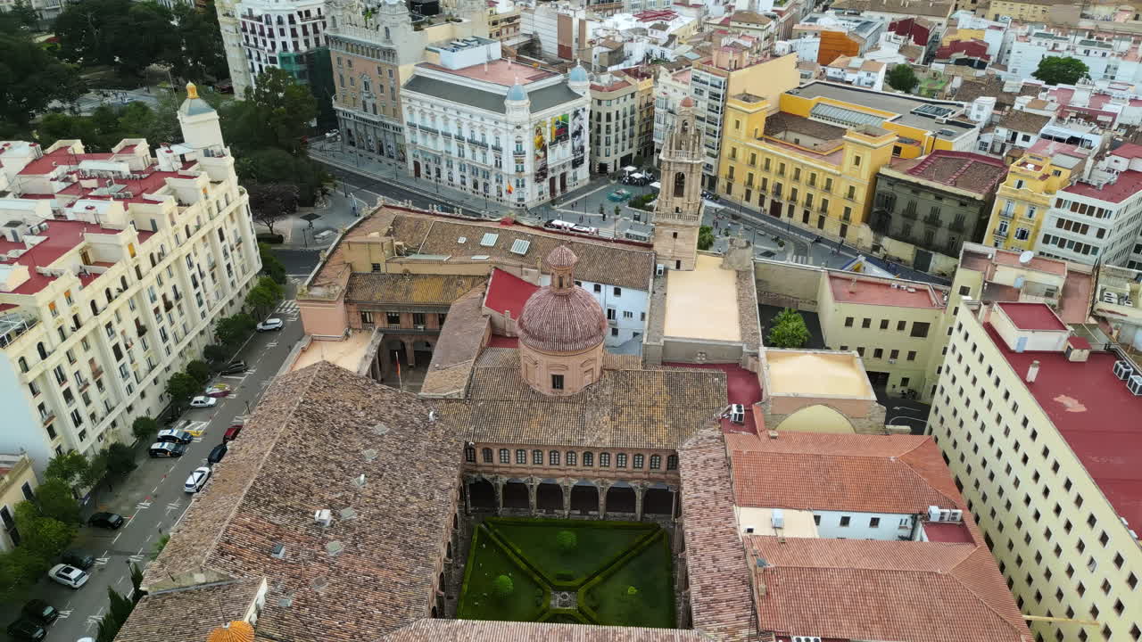 Aerial drone view of the Santa Catalina Church surrounded by buildings in Valencia, Spain