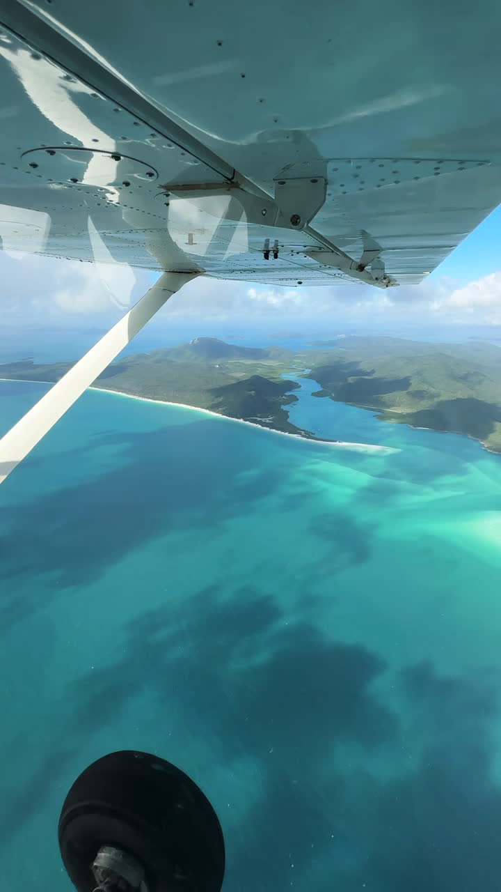 Vertical View, Small Plane Flying Above Islands Near Coast of Queensland, Australia, Passenger POV
