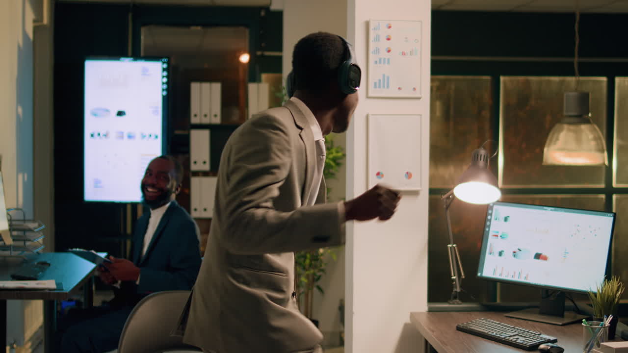 Man Dancing at His Desk While Working