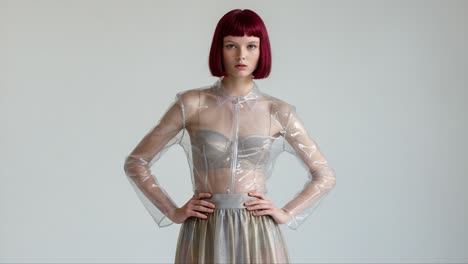 a stunning showcase of modern fashion featuring a model in a sheer plastic jacket and elegant skirt, capturing the essence of contemporary style and beauty