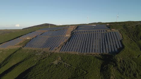 Aerial-view-of-a-photovoltaic-farm-and-a-wind-farm-on-top-of-a-mountain-in-Paul-da-Serra-Madeira-island