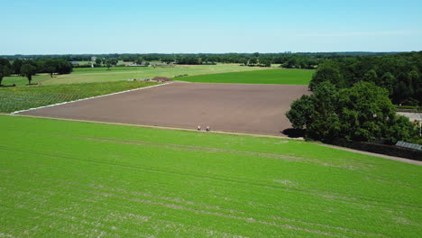 aerial view of a dutch farmland with people cycling