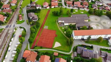 flying over bricked cottage houses in quiet residential area in bavaria at summer, germany