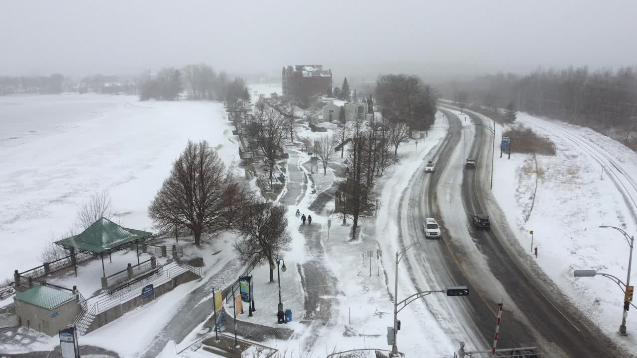 Orford suburban area and winding snowy road passing through a winter landscape, Quebec, Canada.