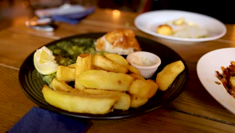 hand grabbing food from plate