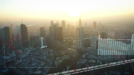 Vista-Panorámica-Aérea-De-Los-Edificios-Del-Centro-De-Negocios-De-Gran-Altura-Contra-El-Brillante-Cielo-Del-Atardecer.-Se-Agregaron-Gráficos-Por-Computadora-Con-Gráficos-Y-Cifras-Financieras.-Fráncfort-Del-Meno,-Alemania