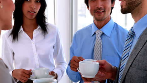 business team having coffee and chatting