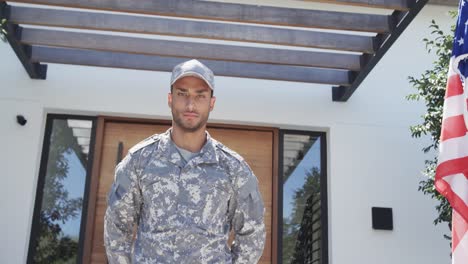 Portrait-of-biracial-male-soldier-saluting-outside-the-house,-unaltered,-copy-space,-slow-motion