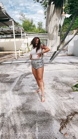 woman dancing in abandoned building