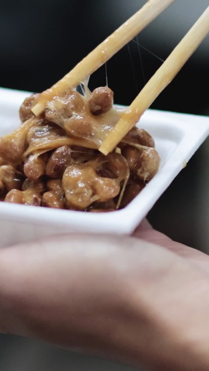 Sequence of eating natto with chopsticks from a bowl