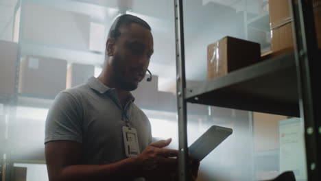 warehouse worker using tablet