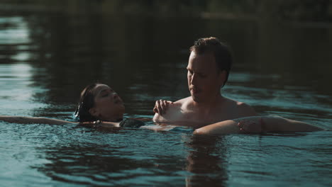 couple swimming in a lake