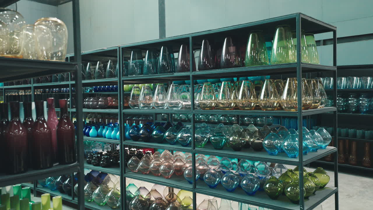 Colorful Glassware Display on Shelves