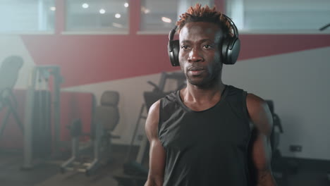 man working out with dumbbells in a gym