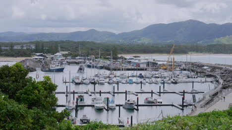wide shot of coffs harbour marina as a fishing vessel arrives back, new south wales, australia