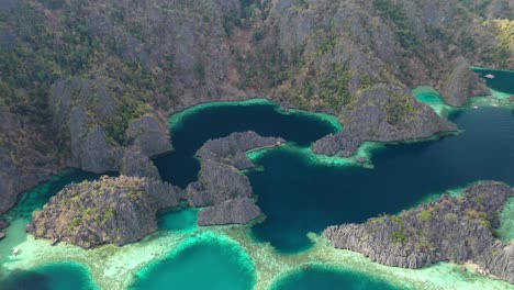 drone aerial view of majestic twin lagoon on coron island, palawan archipelago, philippines