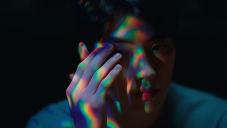 portrait of a man with rainbow light