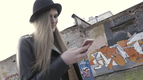 woman using smartphone in urban setting