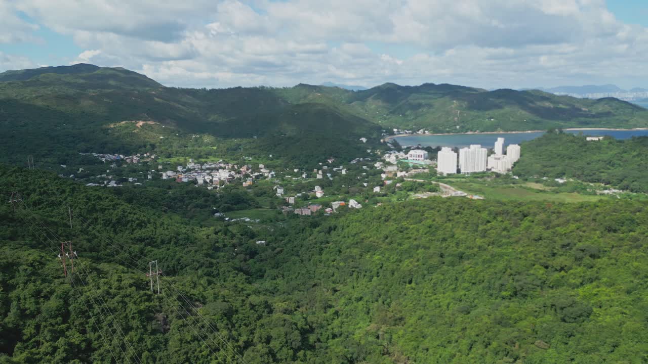 Footage of Mui Wo, a rural town on Lantau Island in Hong Kong, featuring coastal scenery, traditional buildings, lush greenery, and the serene lifestyle of this eastern coastal town