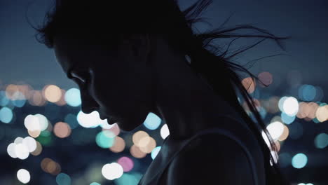 woman in silhouette at night