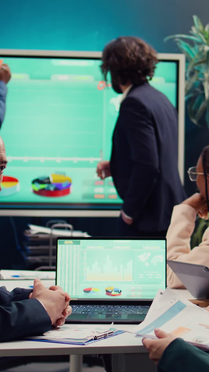 Diverse Business Team Collaborating on Marketing Strategy in Modern Office Meeting