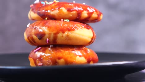 chocolate glazed donuts stacked