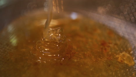 macro close-up of thick golden honey