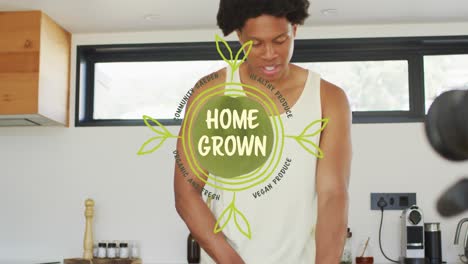 animación de cultivo casero, texto de jardín comunitario sobre hombre afroamericano cortando frutas en la cocina