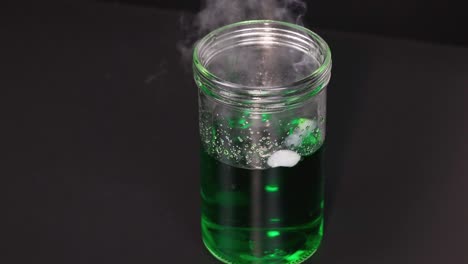 dry ice reacts, creating smoke and bubbles