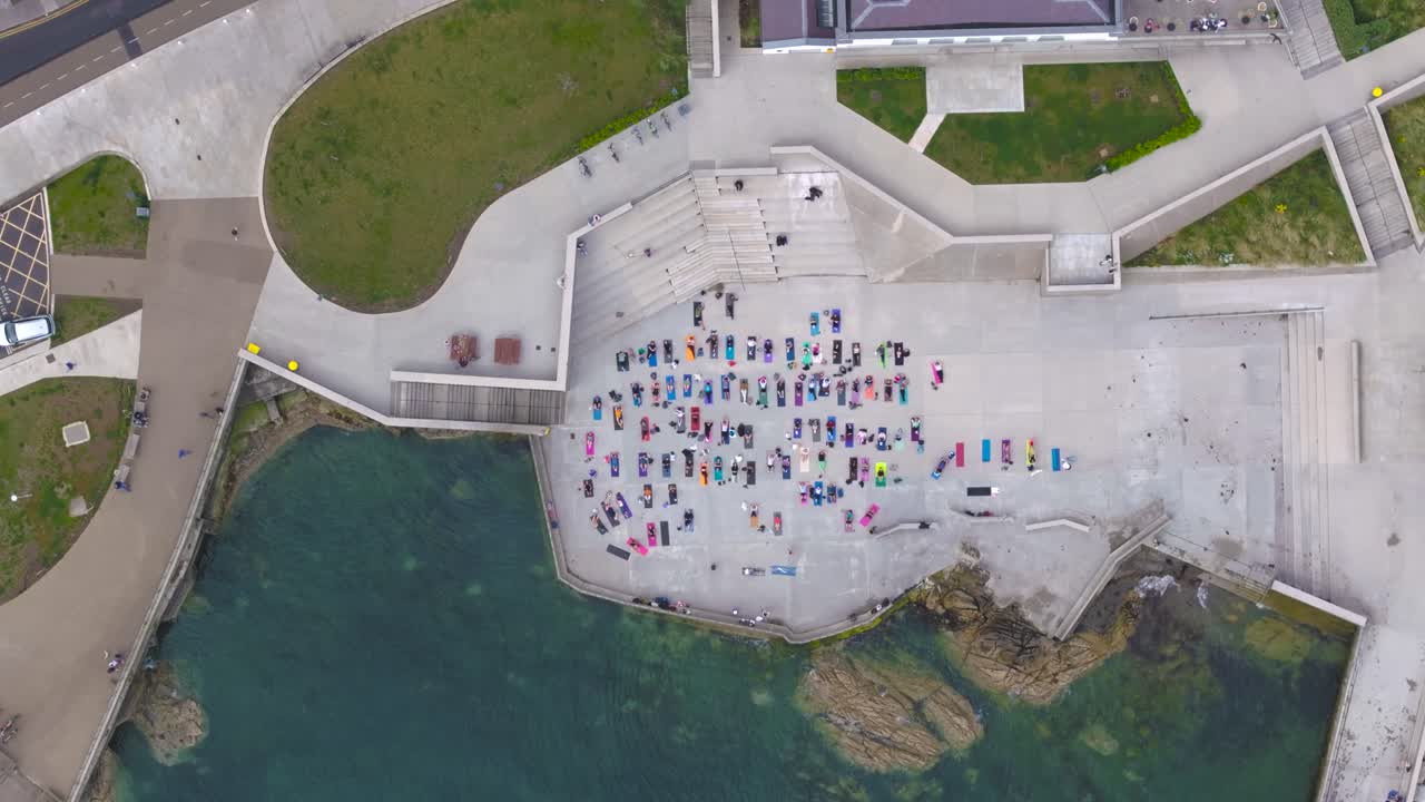 4K cinematic drone footage of a large outdoor yoga class in Dún Laoghaire, Ireland_07