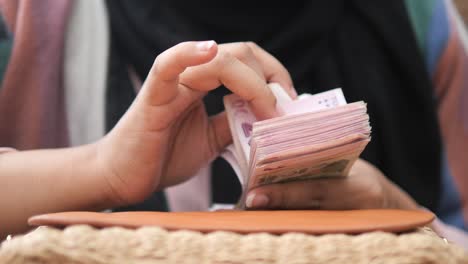 woman counting money