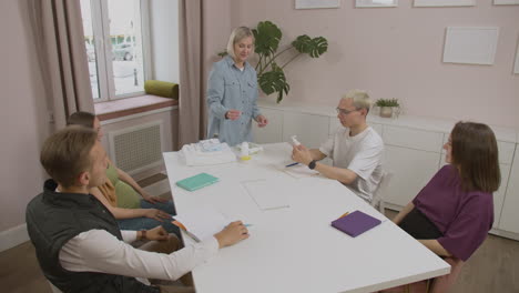 teacher showing products for the baby in class