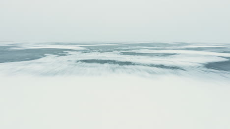 inception movie like fast flying drone shot over foggy frozen ice