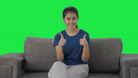 Happy-Indian-teenage-girl-showing-thumbs-up-Green-screen