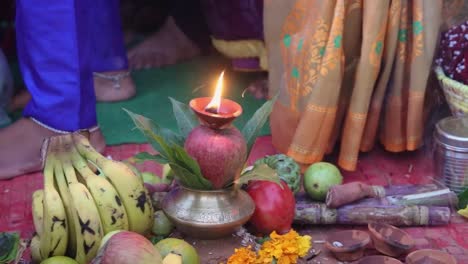 burning oil lamp at river shore during holy rituals at festival from different angle