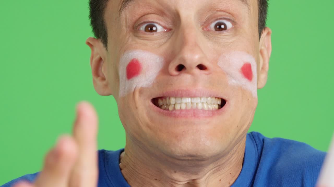 Very nervous man supporting japanese team during a difficult match