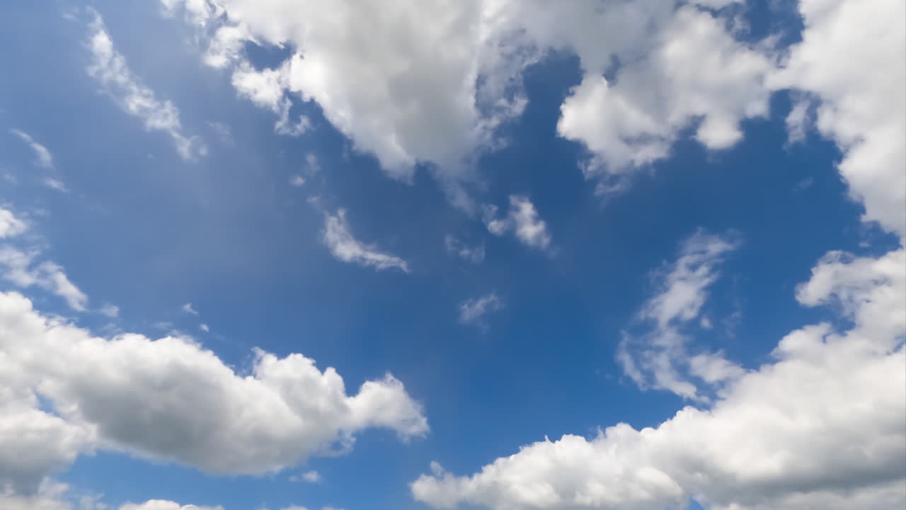 Transformation of beautiful white puffy clouds. Timelapse of amazing cloudscape moving in the sky.