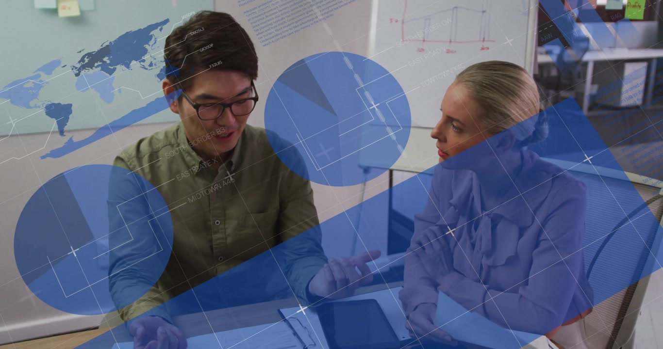 Two colleagues flipping binder pages causing analytics overlays during business data collaboration