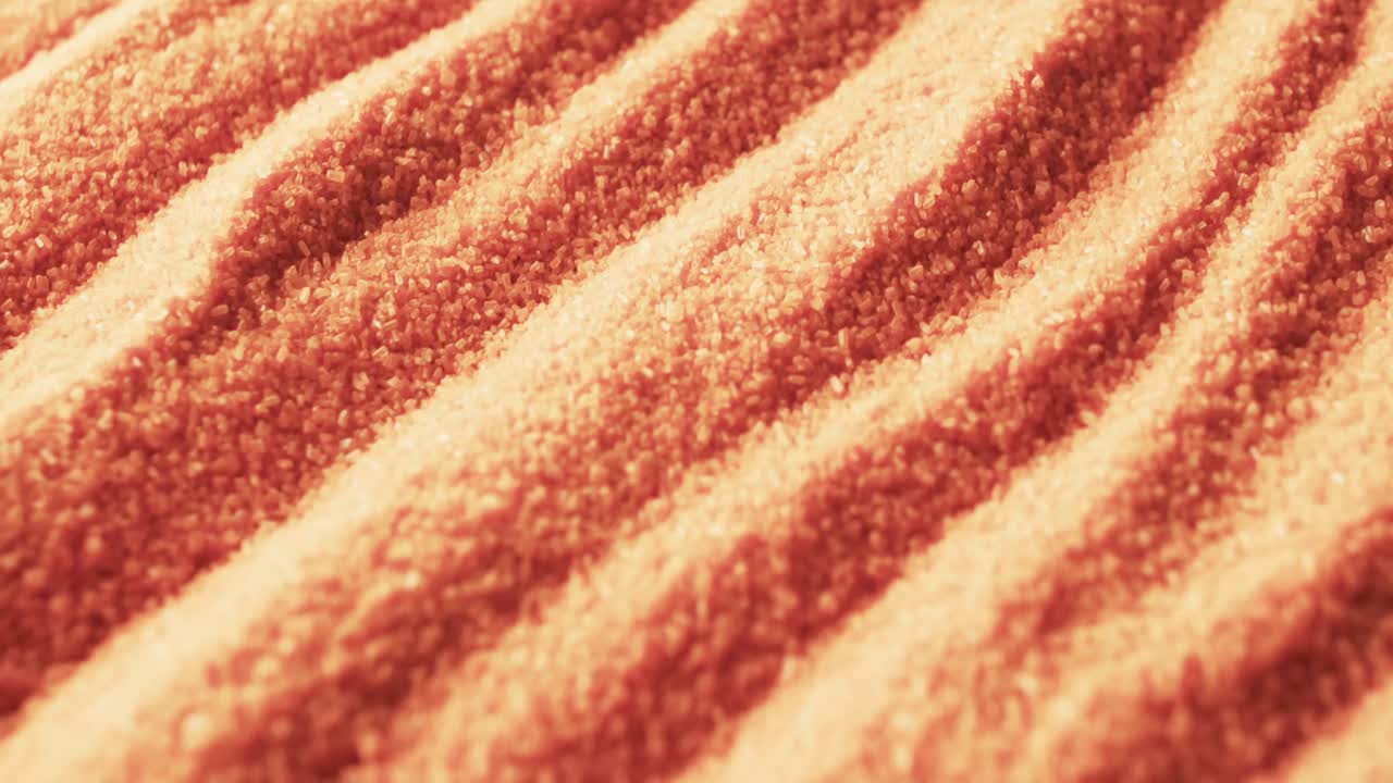 видео крупного плана оранжевого песка с рисунком и копировальным пространством на заднем плане