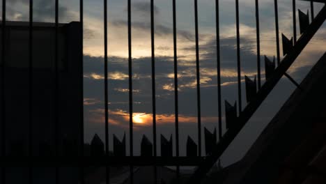 4k-Timelapse-sunset-with-iron-trellis-foreground