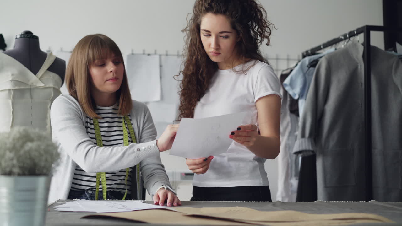 Fashion Designers Discussing Designs