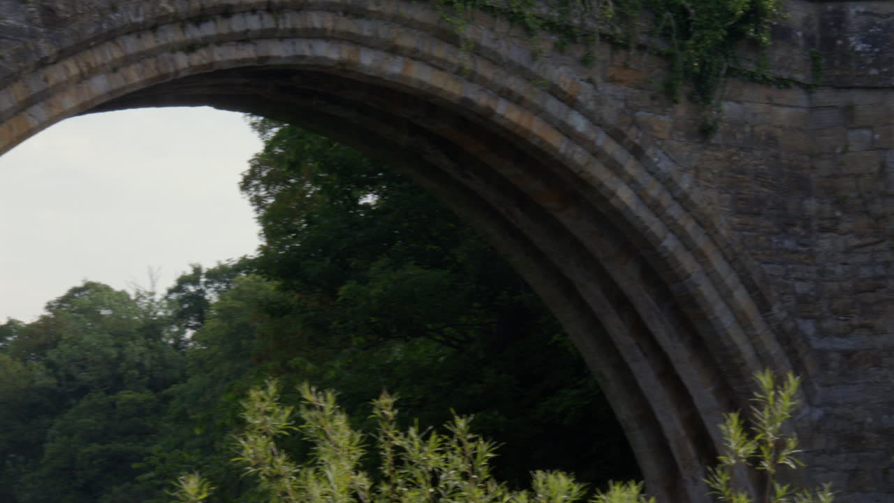 panning shot across the South side of the Devils bridge at Kirkby Lonsdale, North Yorkshire