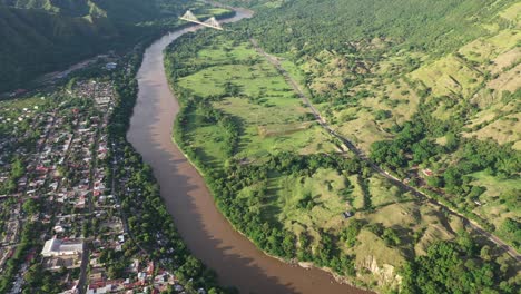 aerial view of honda, colombia and magdalena river on sunny day, small colonial town in tolima region, drone shot