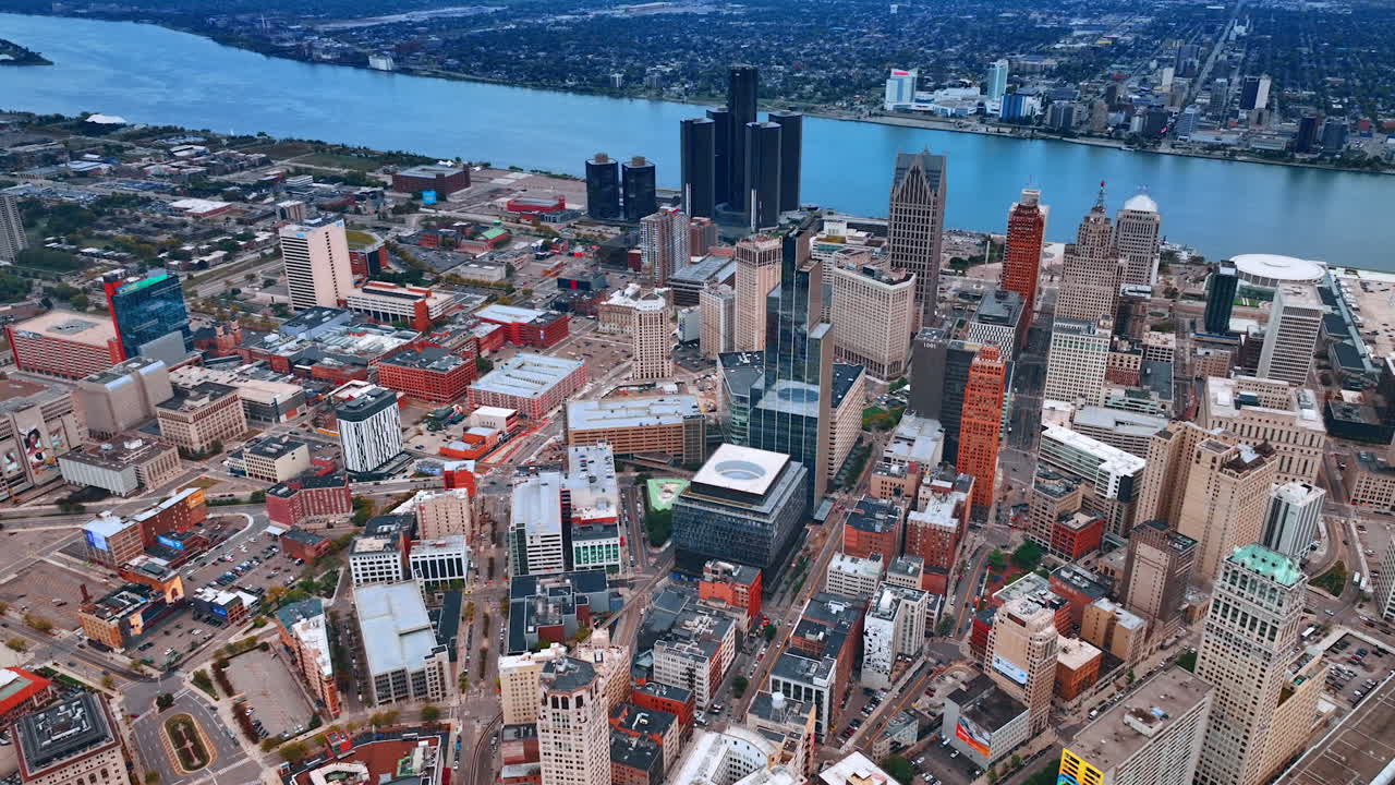 Detroit, USA, 28 July 2025: Flying high over the downtown of modern Detroit, Michigan, USA. Peaceful waterscape of the Detroit River at backdrop