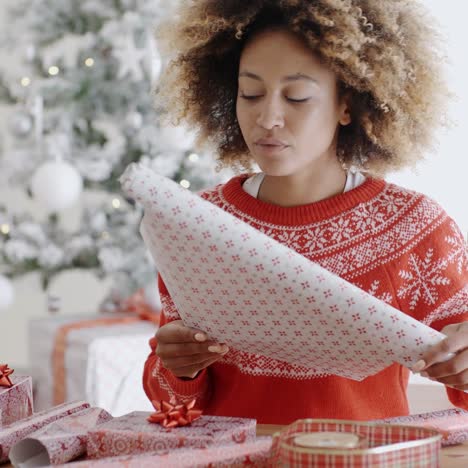 Happy-young--woman-wrapping-presents