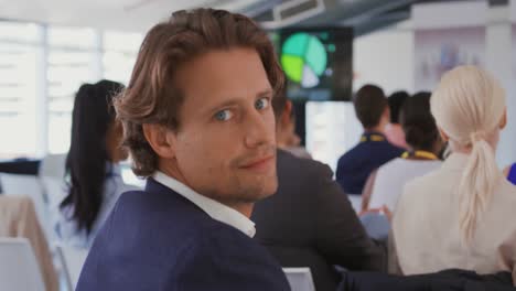 portrait of a man in the audience at a business conference