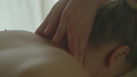 A-person-receives-a-relaxing-neck-and-shoulder-massage-in-a-serene-setting